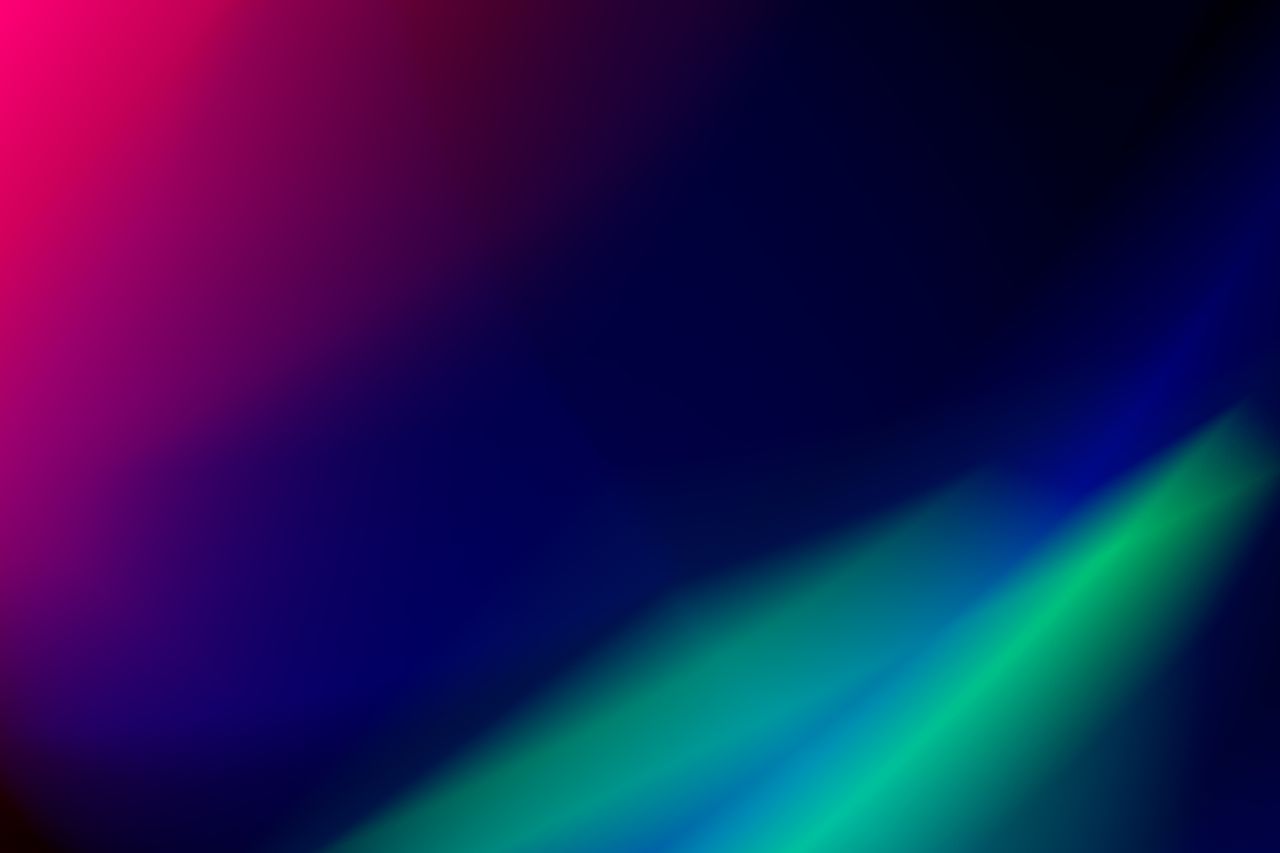 Dynamic abstract gradient with vivid blues, greens, and pinks creating a vibrant and colorful background.